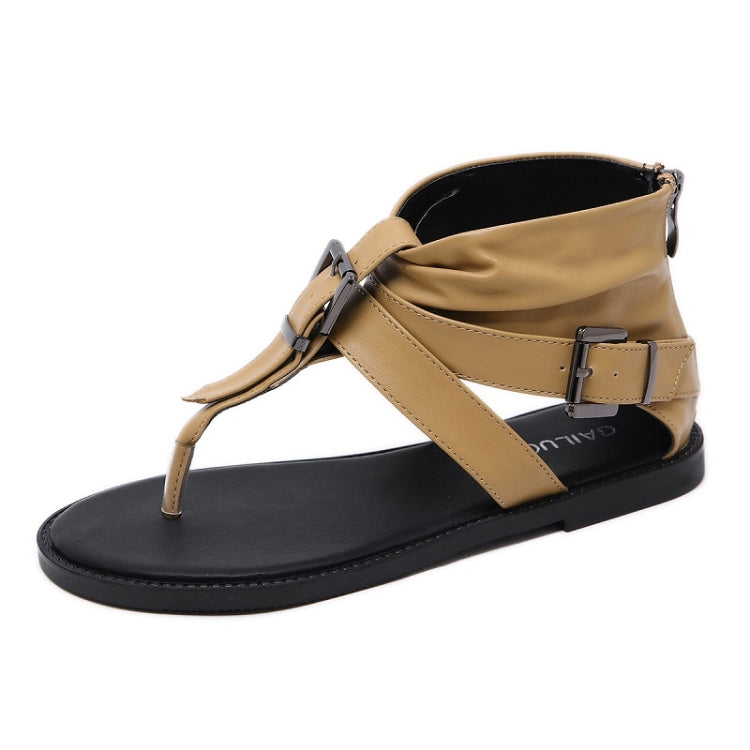 Light brown flat casual sandals with ankle strap and metal belt buckle detail