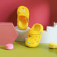 Children's yellow non-slip clogs slippers, front view with open toe and heel strap
