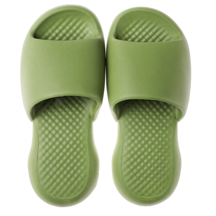 Green open-toe slide slippers with thick cushioned plastic sole and textured footbed