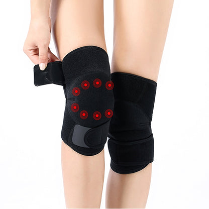 Black self-heating sports knee pads with hook-and-loop straps and red magnet details