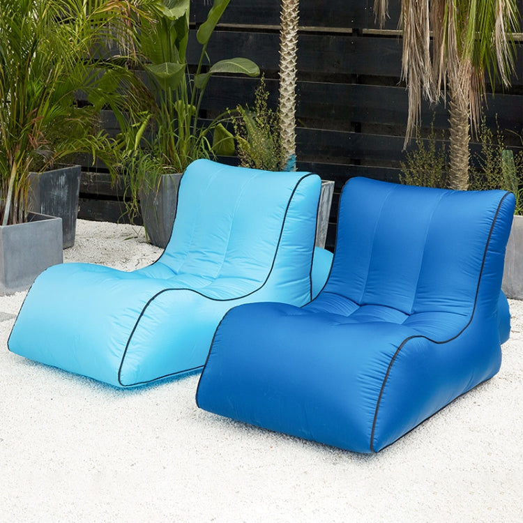 Inflatable lounge seat in pink and white, both with black edging detail.