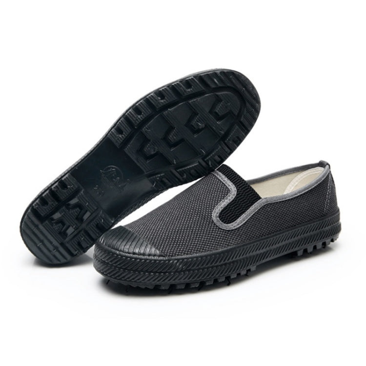 Men's slip-on work shoes with dark rubber outsole and deep tread pattern