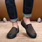 Men's dark gray work shoes with black rubber sole and side elastic panels
