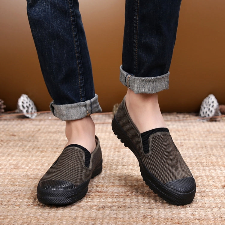 Men's dark gray work shoes with black rubber sole and side elastic panels