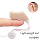 Light tan behind-the-ear hearing aid amplifier in hand with earbud receiver