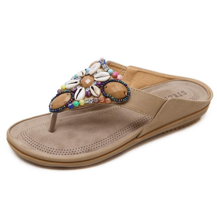 Tan thong sandals with colorful shell and bead embellishment and perforated footbed