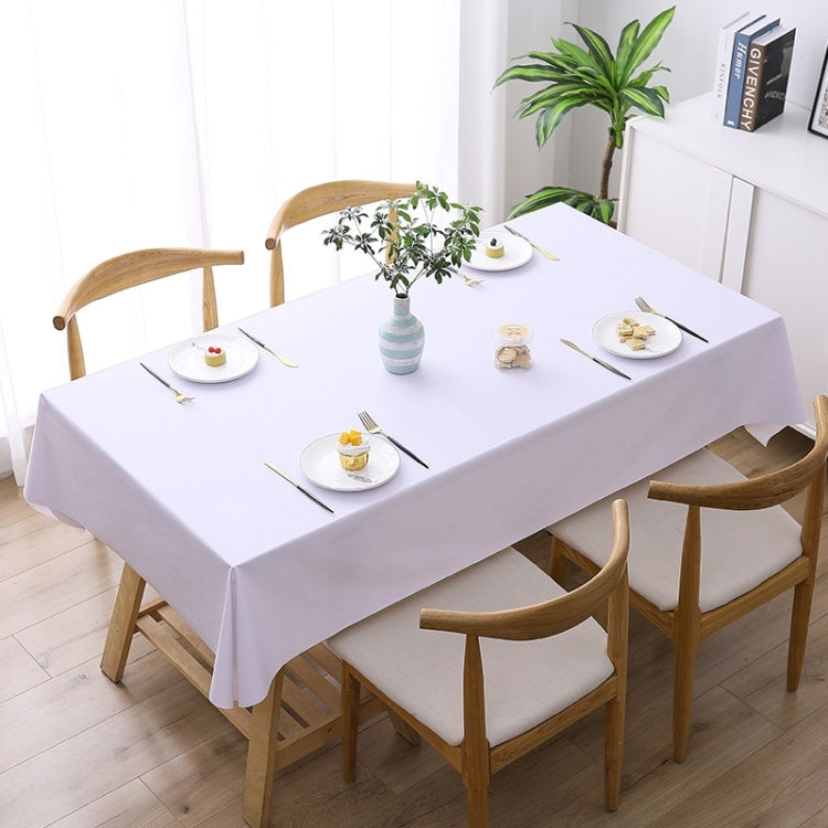 White waterproof disposable tablecloth spread across a dining table