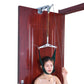 Door-hanging cervical traction sling with green straps and head cradle over neck