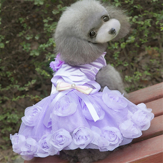 Purple dog dress with a striped bodice, satin bow, and layered rose-trimmed skirt