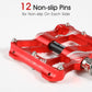 Red aluminum alloy bike pedal with non-slip pins and axle