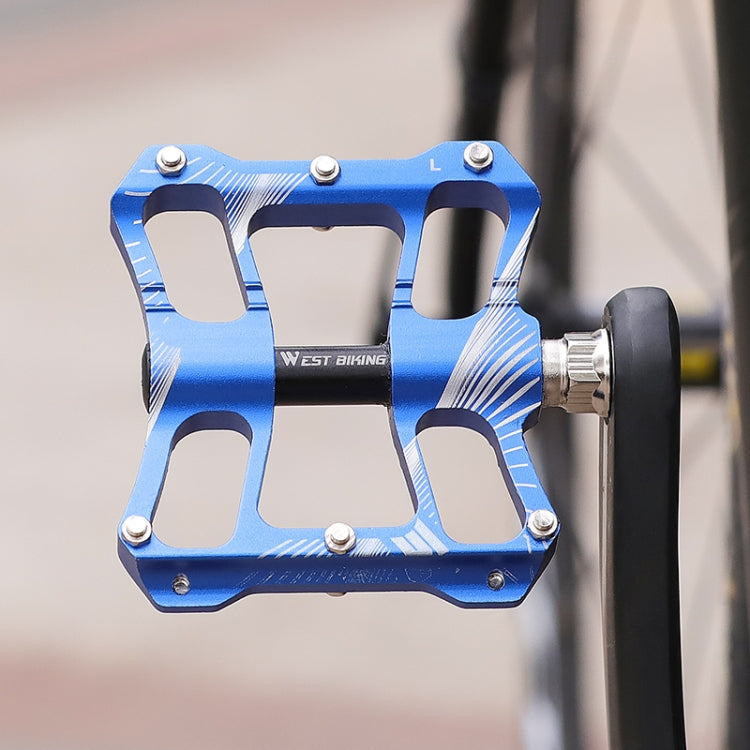 Blue aluminum alloy bike pedal with textured grip pins and axle