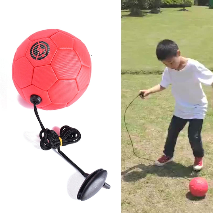 Red children training football with attached rope and training base
