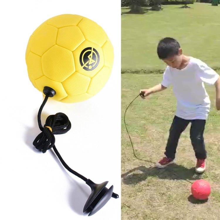 Yellow children training football with attached rope
