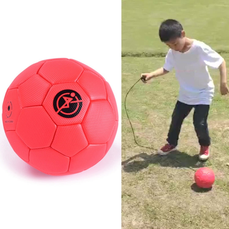 Red children training football shown close-up
