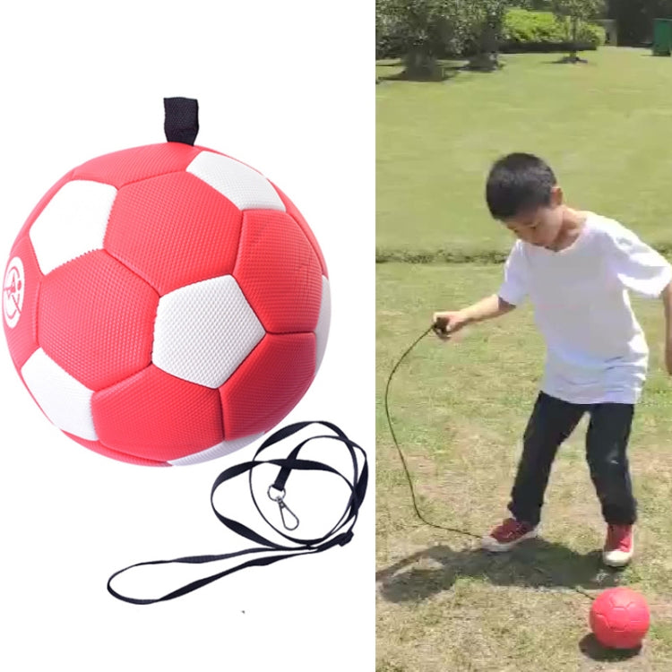 Red kids training football with attached black rope