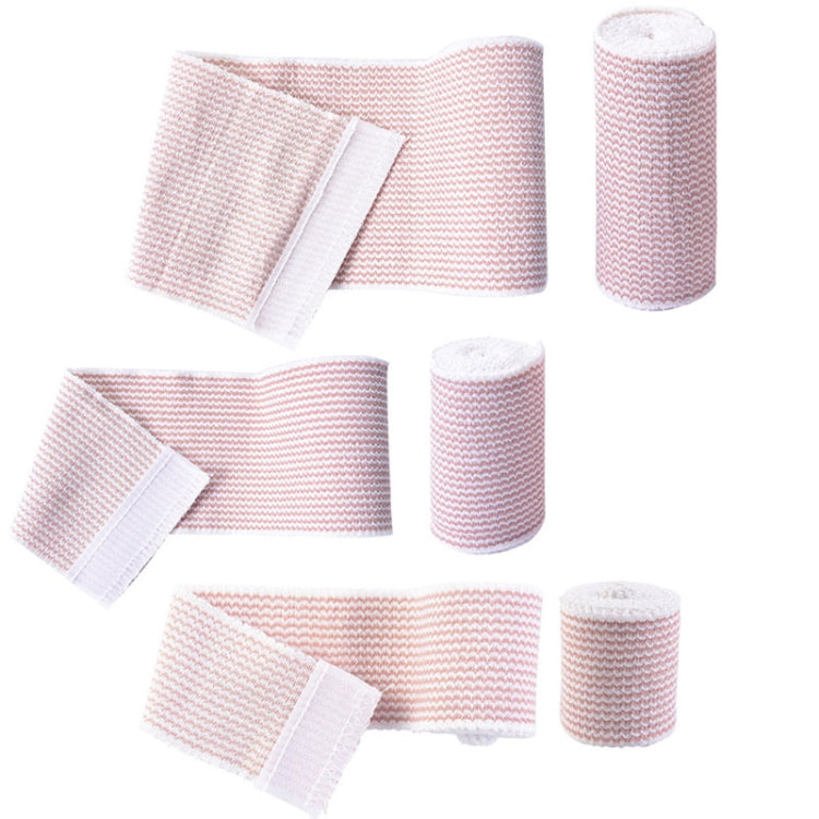 Assorted pink-and-white compression bandage pieces and rolls, elastic self-adhesive tabs