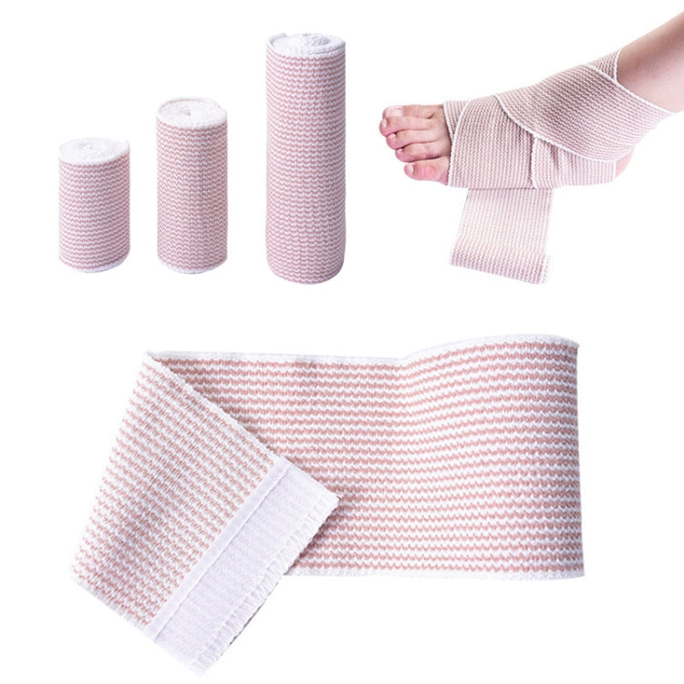 Pink-and-white elastic compression bandage strip with adhesive backing, plus coiled rolls