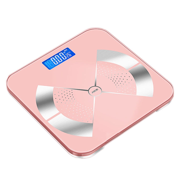 Pink digital body fat scale with blue LCD readout and four-panel sensor electrodes
