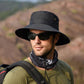Black wide-brim sun hat with chin strap and metal eyelet detail