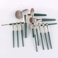 14-piece makeup brush set with green handles and silver ferrules, fanned arrangement