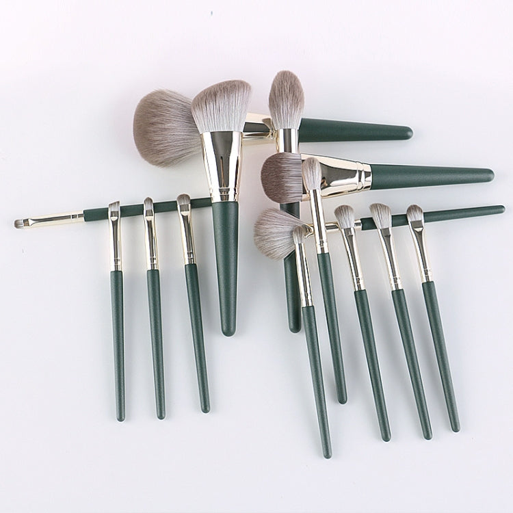 14-piece makeup brush set with green handles and silver ferrules, fanned arrangement