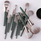 Makeup brush set with green handles and silver ferrules, assorted brush shapes