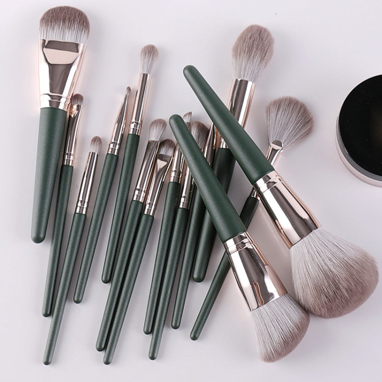Makeup brush set with green handles and silver ferrules, assorted brush shapes
