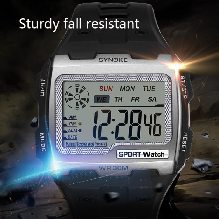 Silver digital sport watch close-up with large LCD screen and rugged case