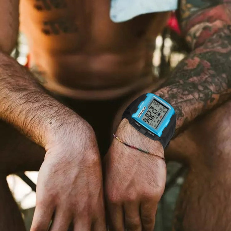 Blue digital sport watch worn on wrist with black rubber strap