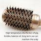 Close-up ceramic roller brush with gold barrel and black bristles, textured handle