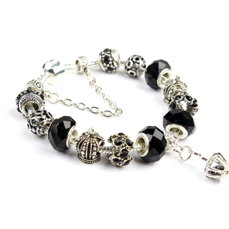 Handmade crystal beaded bracelet with black faceted beads and silver-tone charm accents