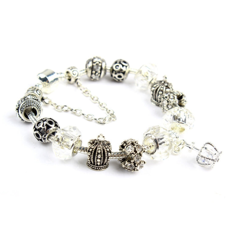 Silver-tone crystal and glass bead bracelet with crown charm and dangling clear beads