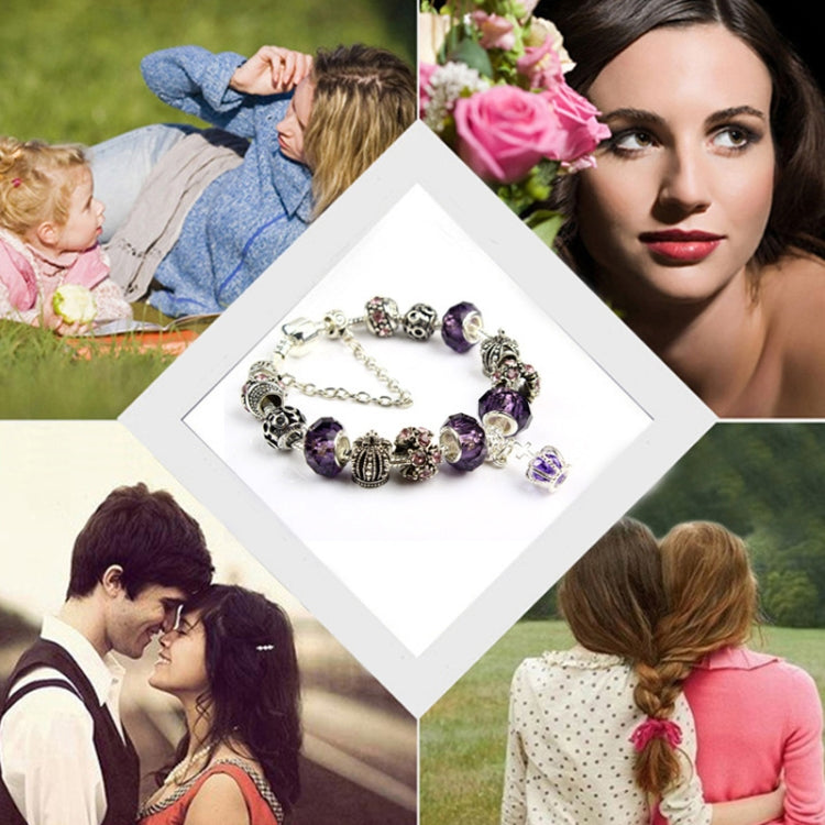 Crystal beaded charm bracelet with purple beads and crown charms, silver-tone chain