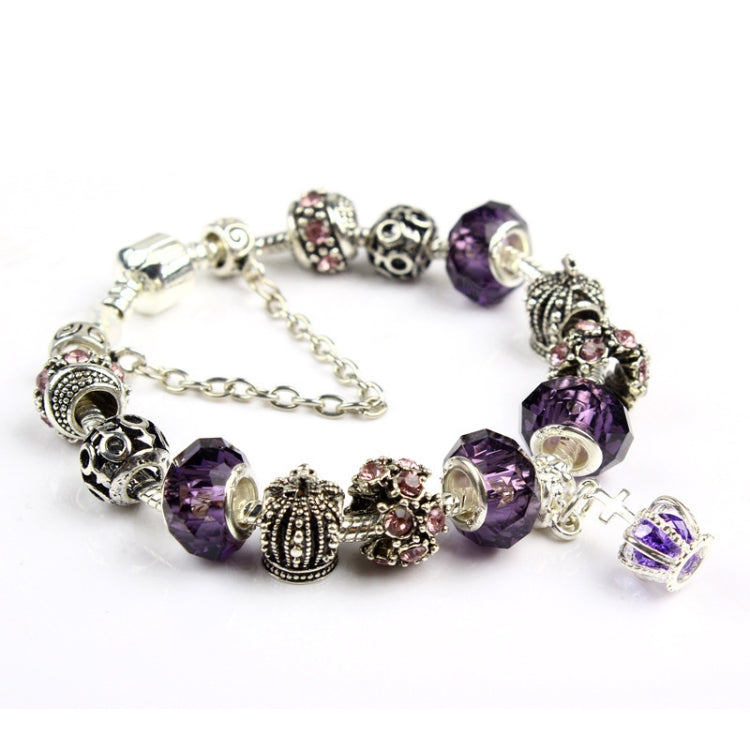 Crystal beaded bracelet with purple faceted beads and decorative silver-tone end caps