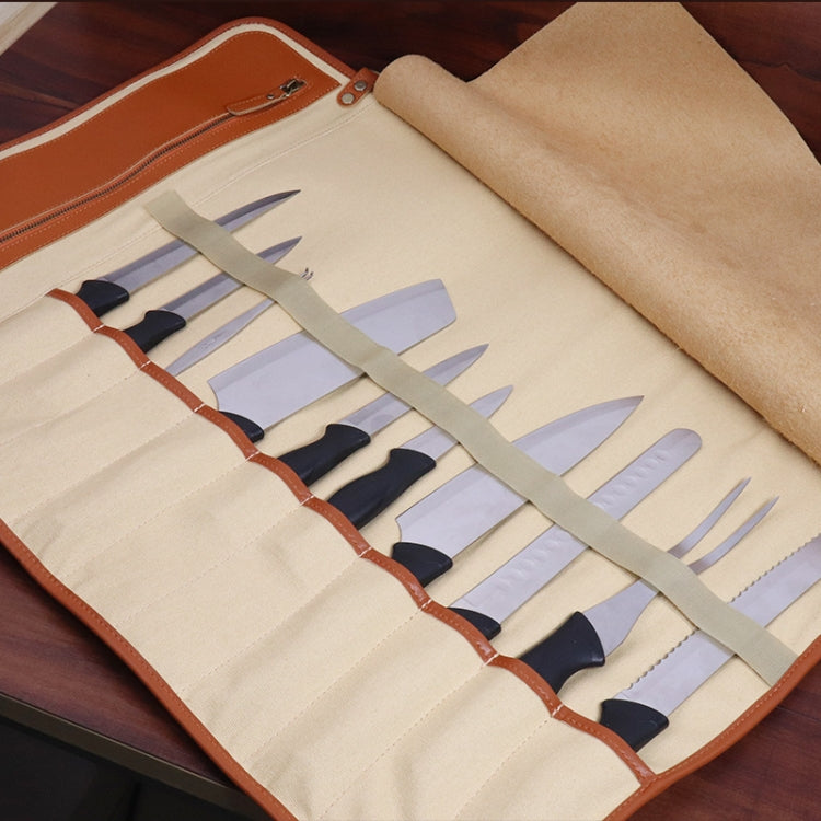 Opened chef knife storage roll bag showing multiple knife slots and stitched leather trim