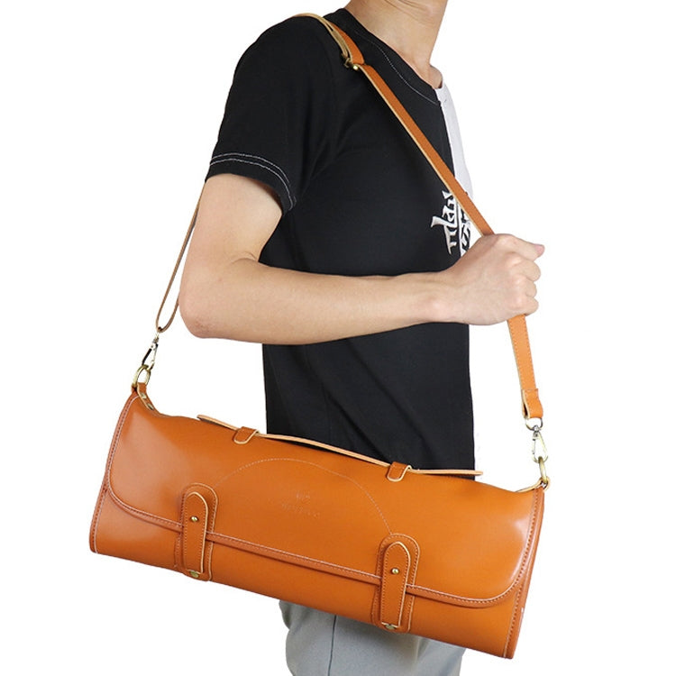 Brown chef knife storage roll bag carried on the shoulder with adjustable strap