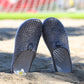 Breathable half slipper shoes in dark navy knit with textured dots and heel tabs
