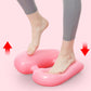 Pink inflatable yoga massage foot pad supporting bare feet for leg exercise