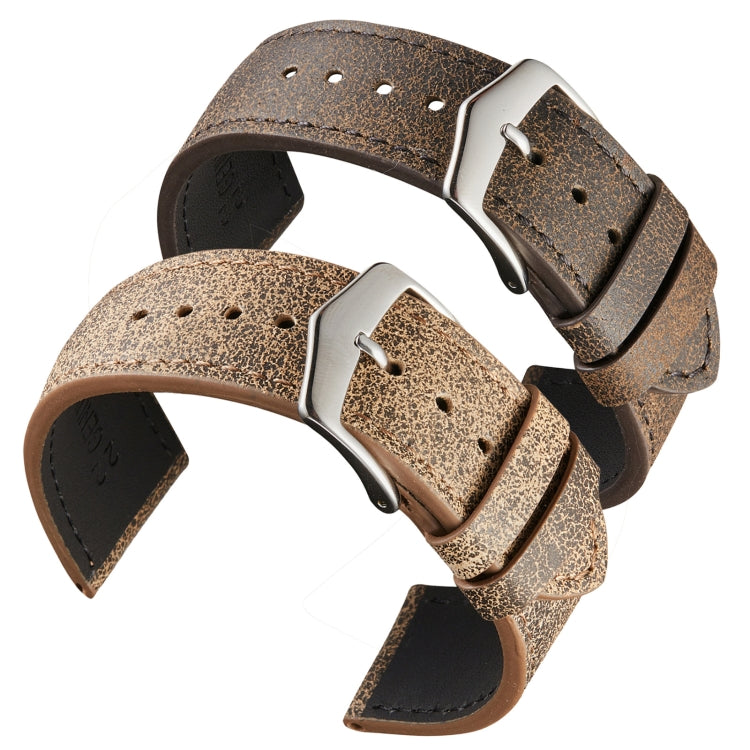 Two cowhide watch straps with silver buckles, perforated holes, textured grain finish