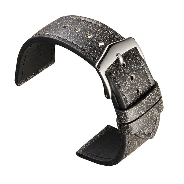 Black leather watch strap with silver buckle, perforation holes and stitched strap ends