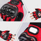 Red half-finger cycling glove close-up showing knuckle armor and ventilation palm