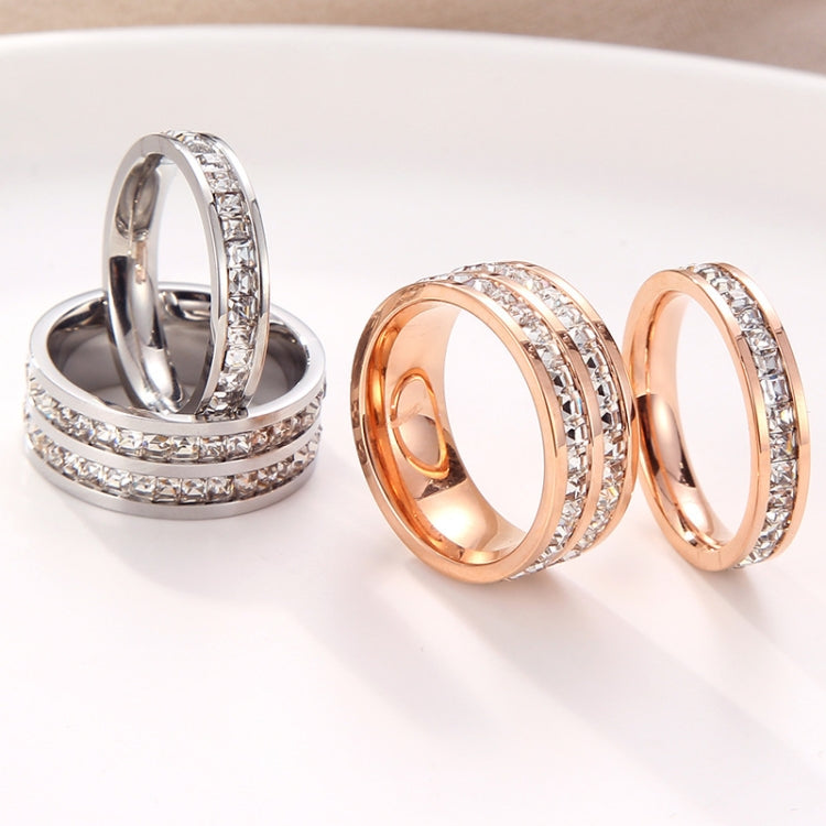 Diamond band ring set in silver and rose gold tones, three rings shown