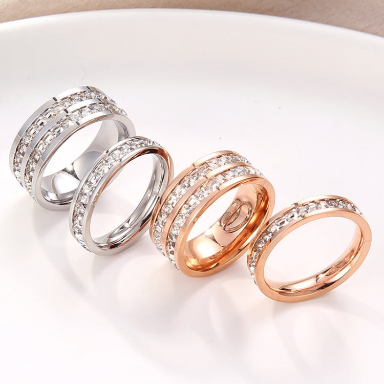 Diamond band rings set in silver and rose gold tones, four rings shown
