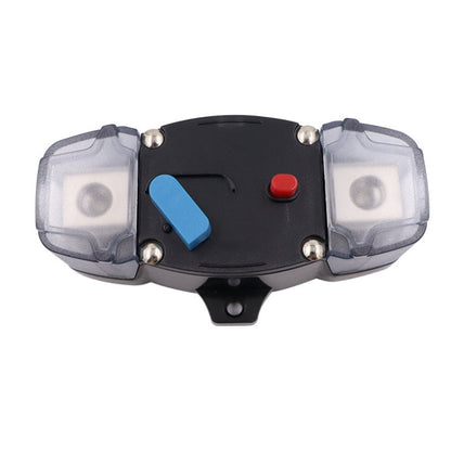 Automatic circuit breaker power switch with blue lever, red button, clear terminal covers