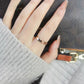 Narrow rose gold ring on finger with engraved inner text, electroplated band