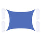 Blue outdoor shade sail with corner grommets and white hanging ropes