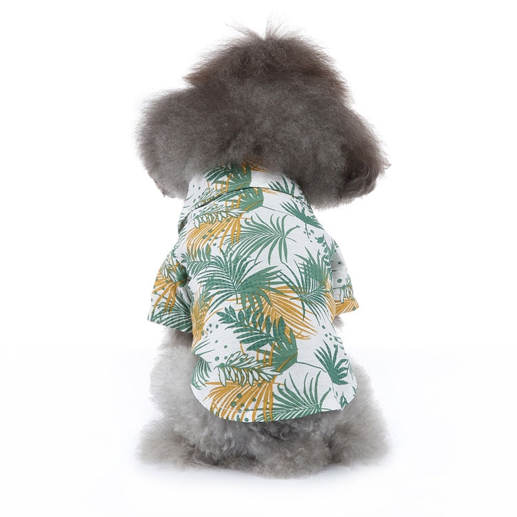 White dog summer shirt with green and yellow tropical leaf print