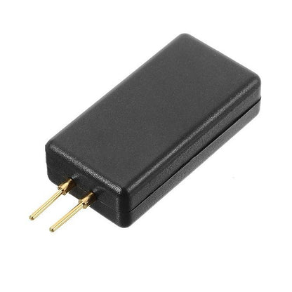 Black car airbag detection tool module with two gold pins and flat rectangular case