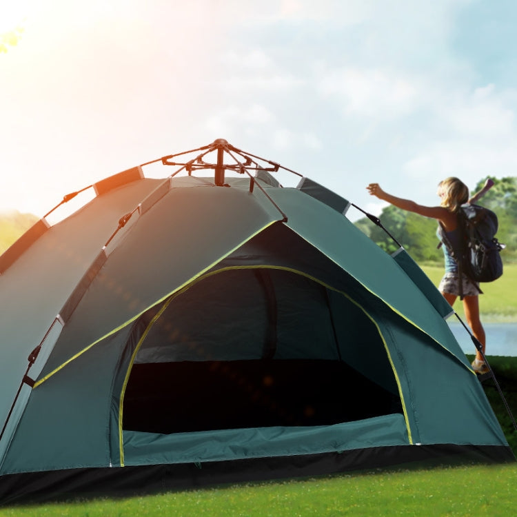 Orange and green automatic spring multi-person tent with arched front door and mesh panels.