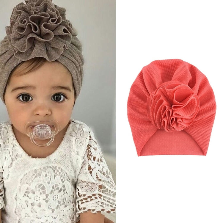 Baby turban hat in coral pink with textured rosette flower, one size